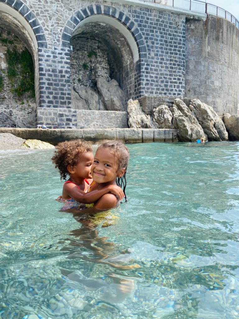 Sydney and Aubrey in the water at the Amalfi Coast